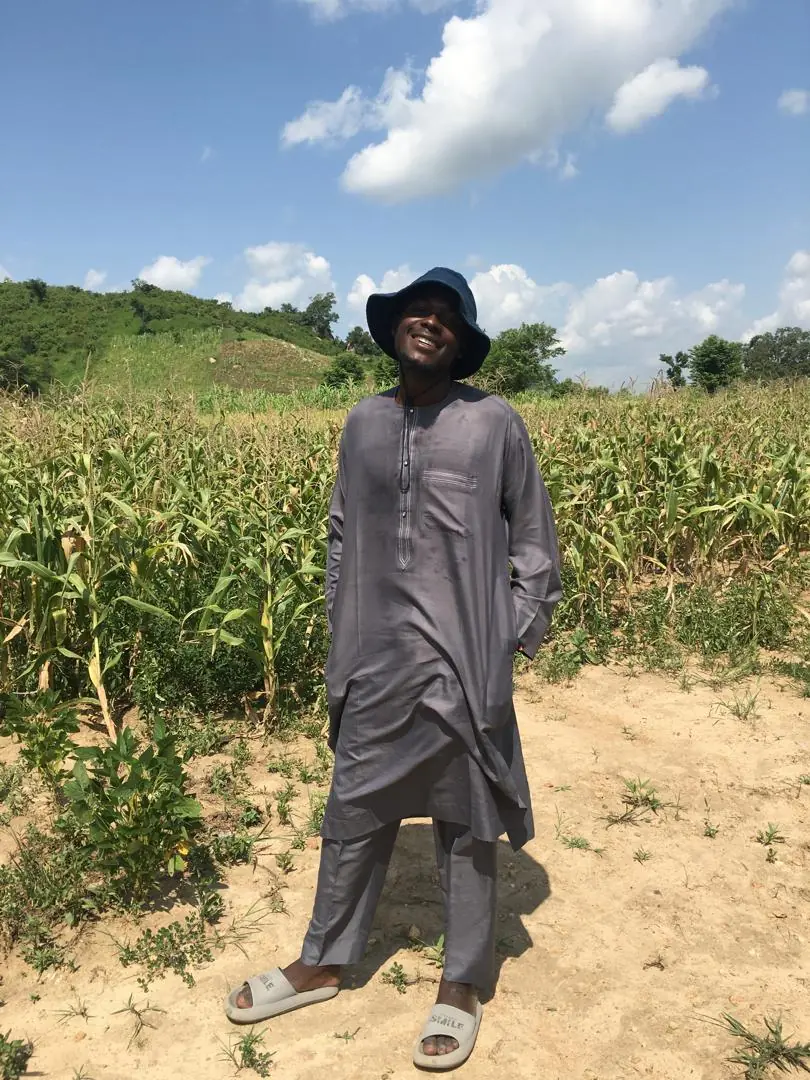 Ahmad Ibrahim, Founder and Chief Executive Officer of TechAgroBridge, standing in a field