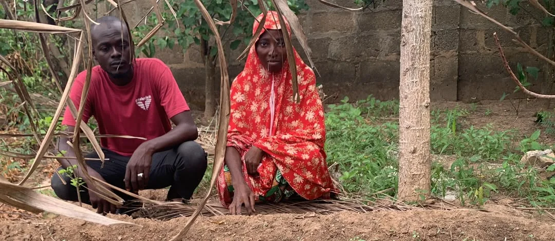 Field personnel inspecting a nursery plot
