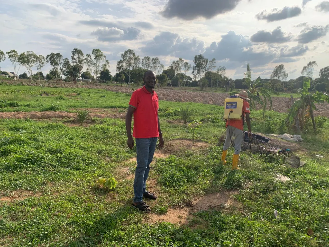 TechAgroBridge representative documenting cultivated land during a field operation